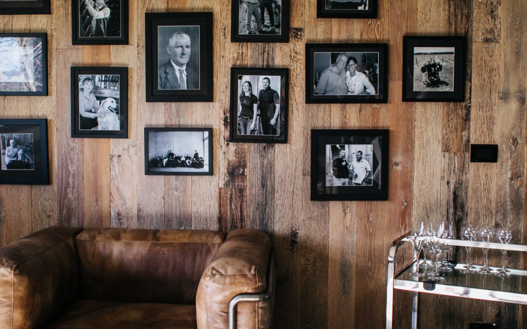 A personalized wooden wall featuring pictures created by Personal Touch Printing.